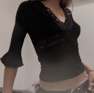 flared sleeves with black cami shirt.